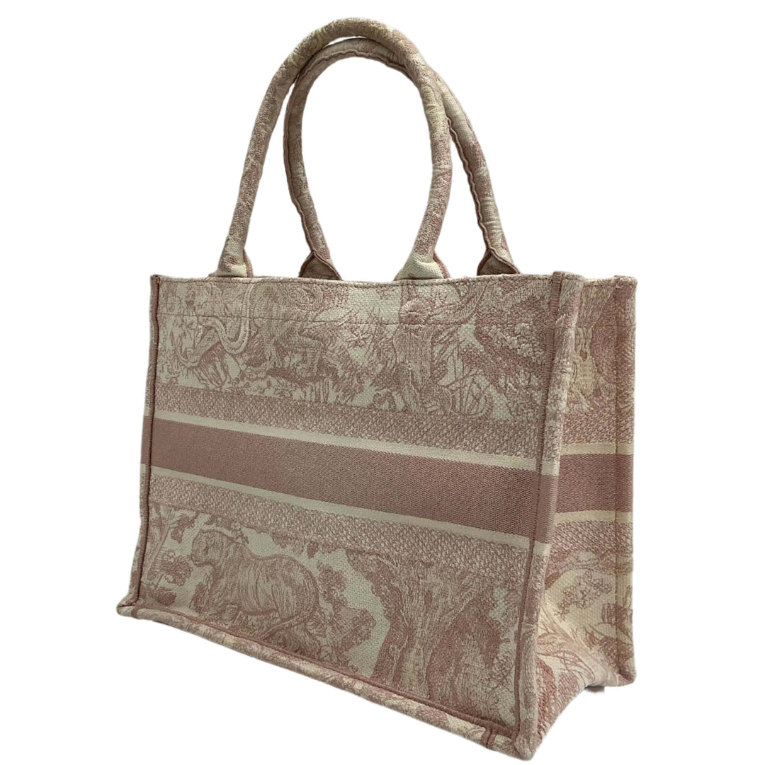 Christian Dior Medium Dioriviera Book Tote in Toile De Jouy pattern featuring intricate embroidery and elegant design.