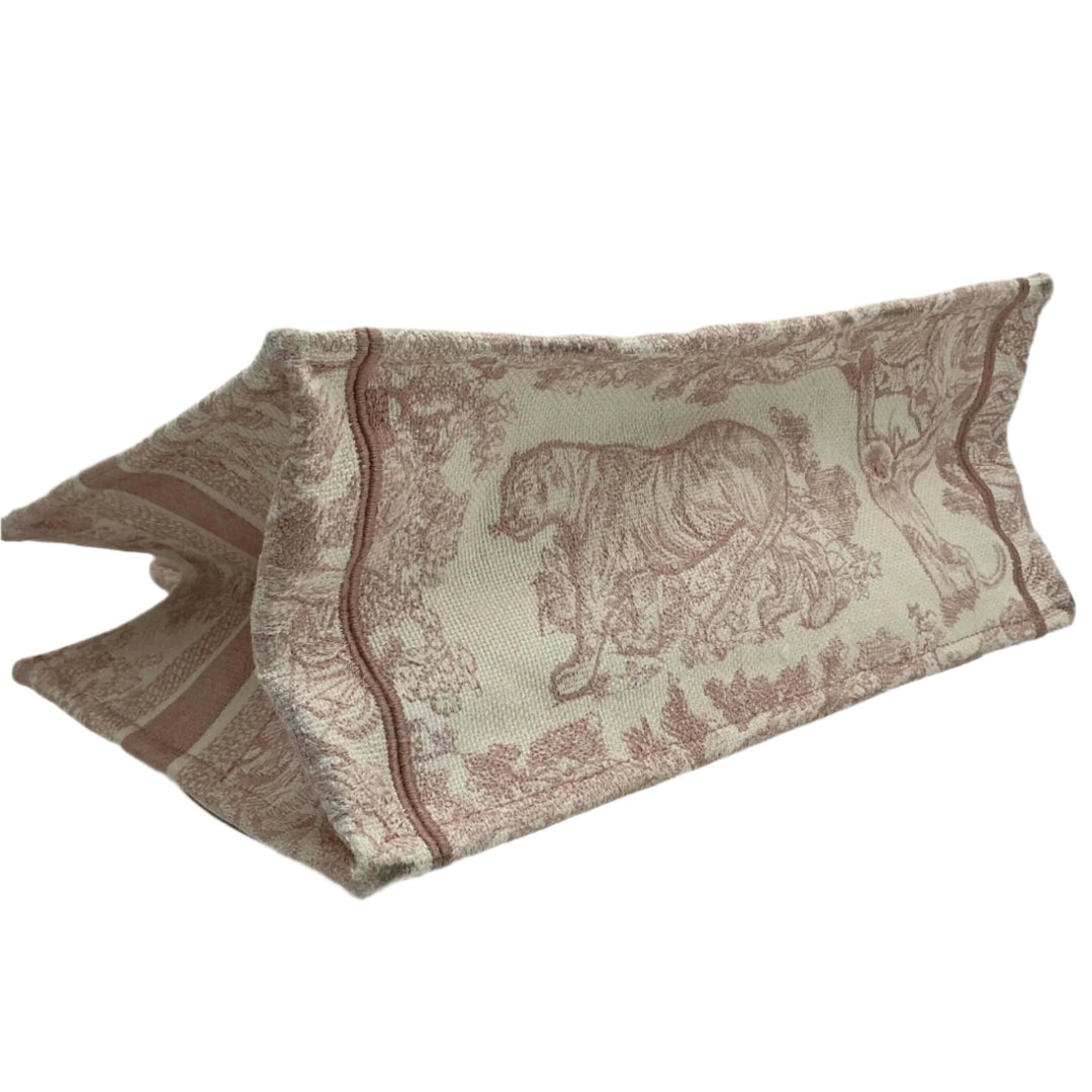 Christian Dior Medium Dioriviera Toile De Jouy tote featuring rose-embroidered canvas and elegant animal motifs.