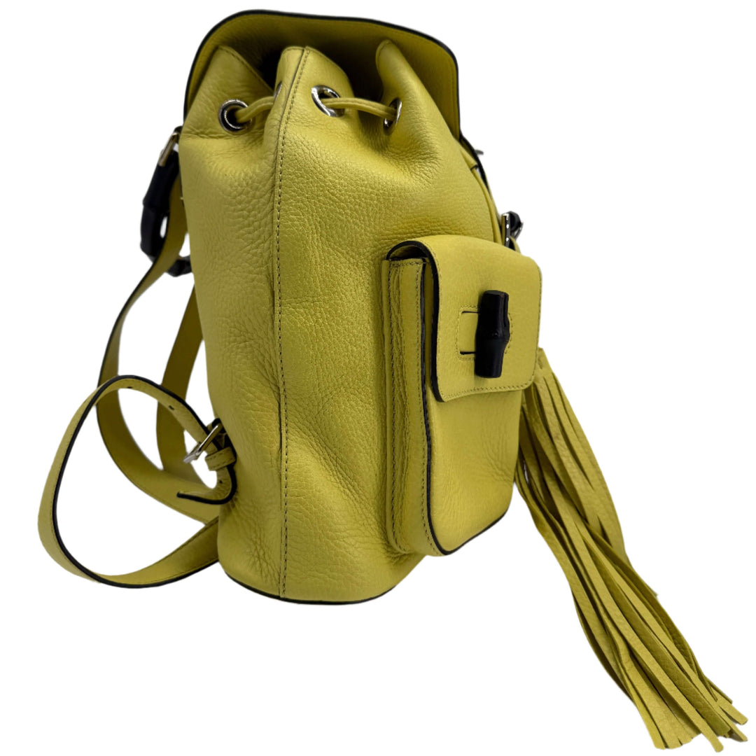 Gucci Cellarius Medium Bamboo Backpack in vibrant mimosa yellow, featuring soft calfskin leather and stylish tassel.