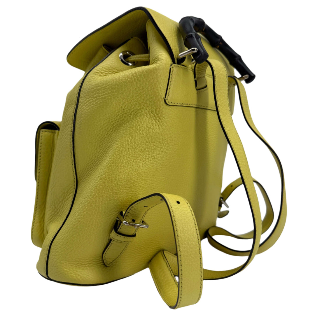 Gucci Cellarius Medium Bamboo Backpack in vibrant mimosa yellow calfskin leather, showcasing its stylish design and craftsmanship.