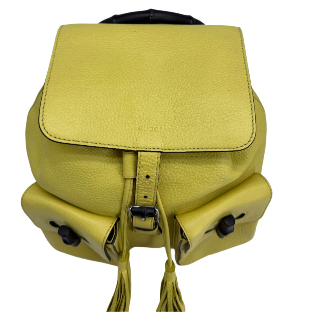 Gucci Cellarius Medium Bamboo Backpack in vibrant mimosa yellow calfskin leather with structured design.