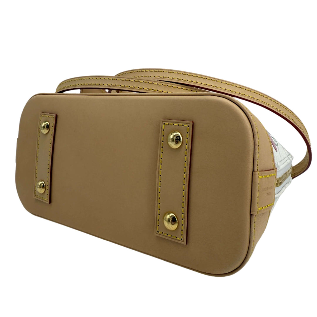 Underside view of Louis Vuitton x Takashi Murakami Alma BB bag showcasing craftsmanship and design details.