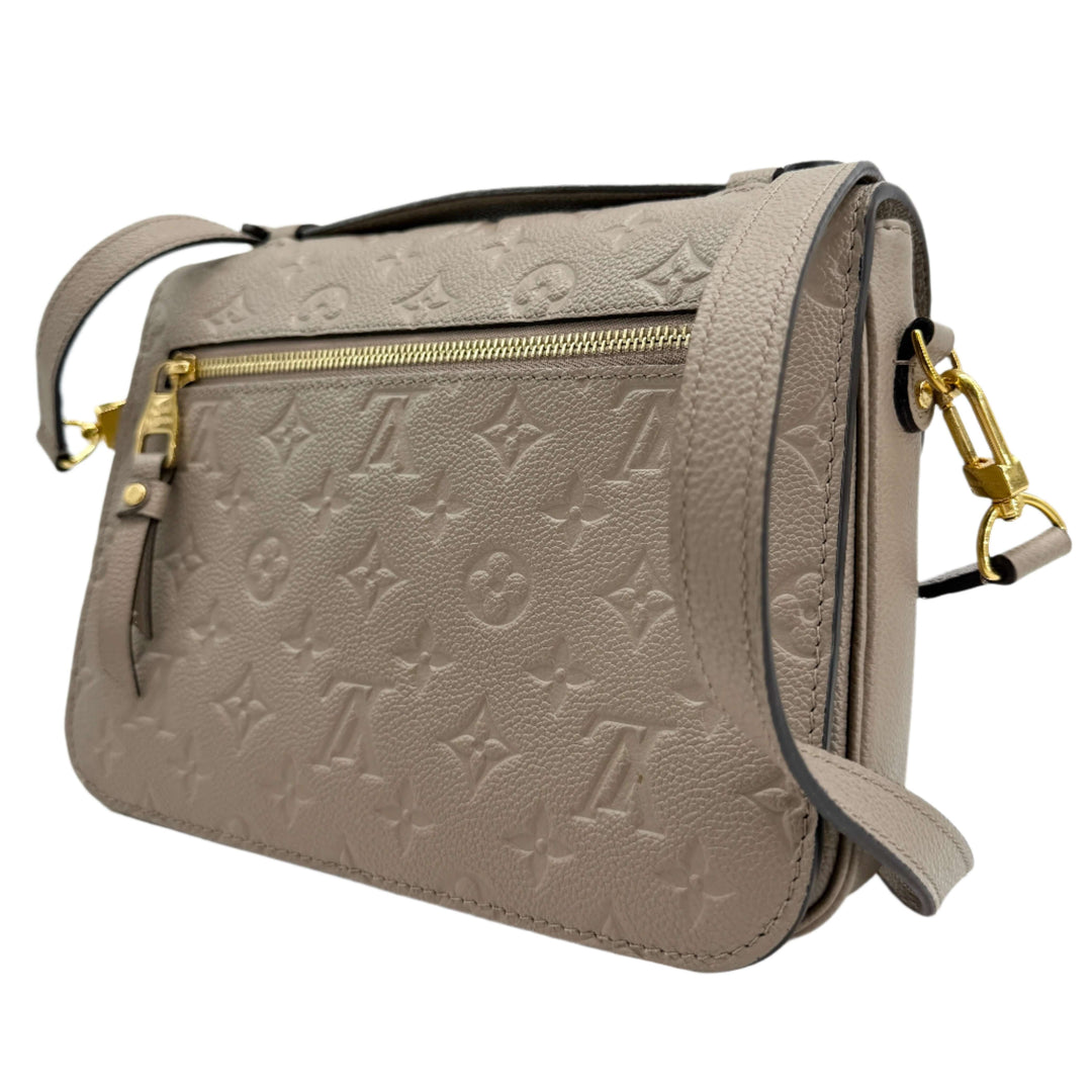 Louis Vuitton Pochette Métis in Tourterelle Grey, Monogram Empreinte Leather, showcasing elegance and functionality.