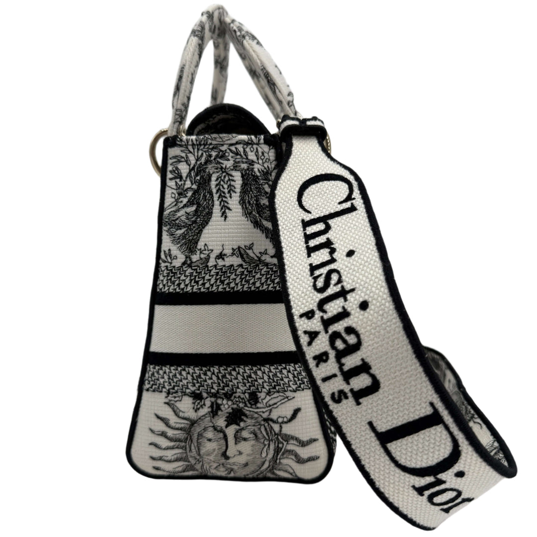 Christian Dior Lady D-Lite Medium Bag in embroidered canvas with black and white design and logo strap.