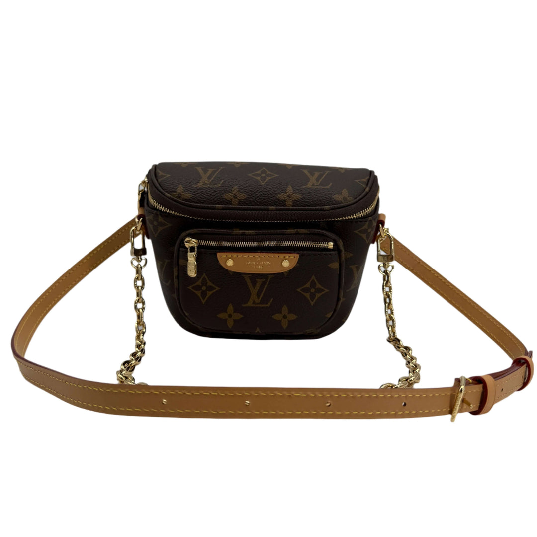Louis Vuitton Mini Bumbag in Monogram Canvas with Adjustable Leather Strap and Removable Chain for stylish hands-free convenience.