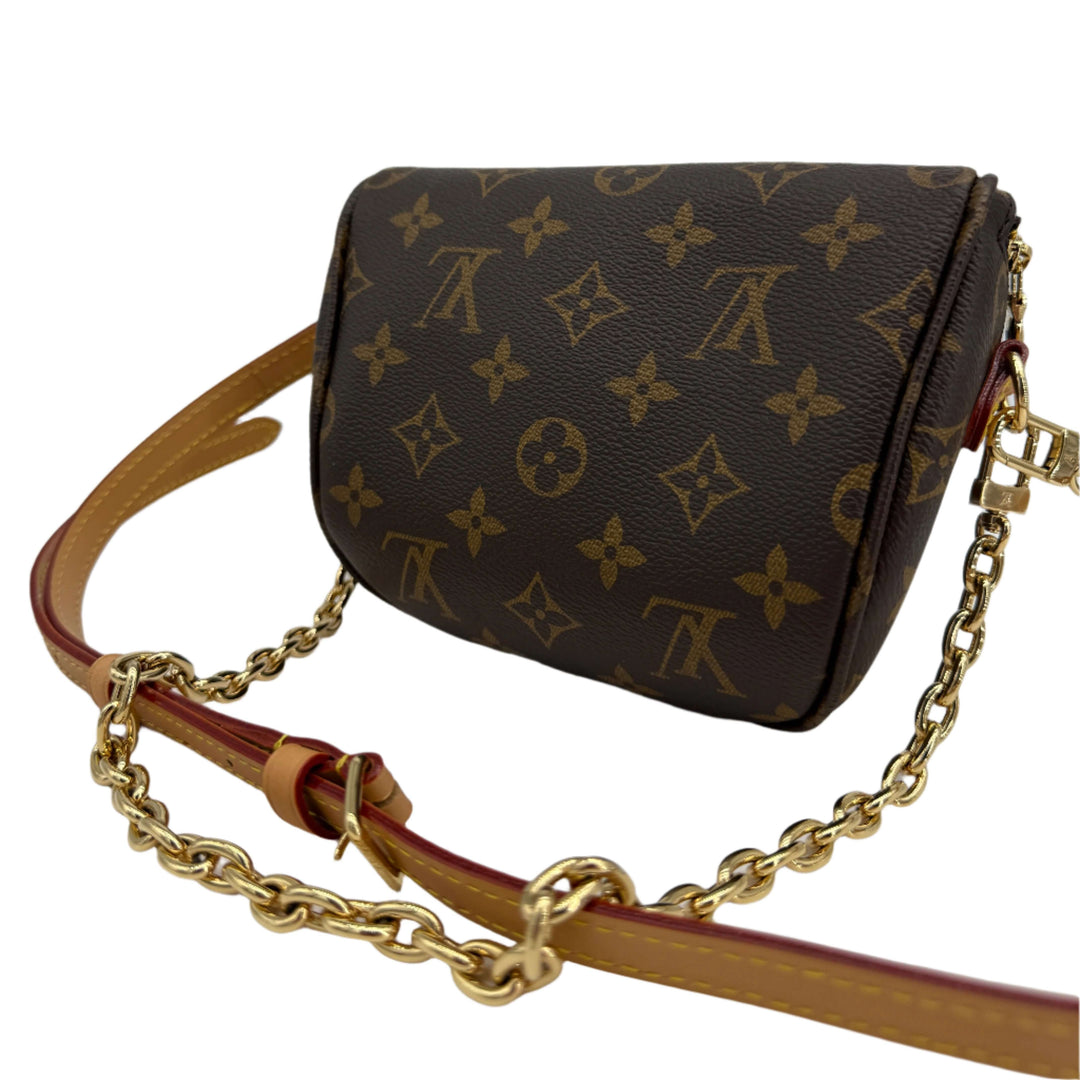 Louis Vuitton Mini Bumbag in Monogram Canvas with adjustable leather strap and removable chain.
