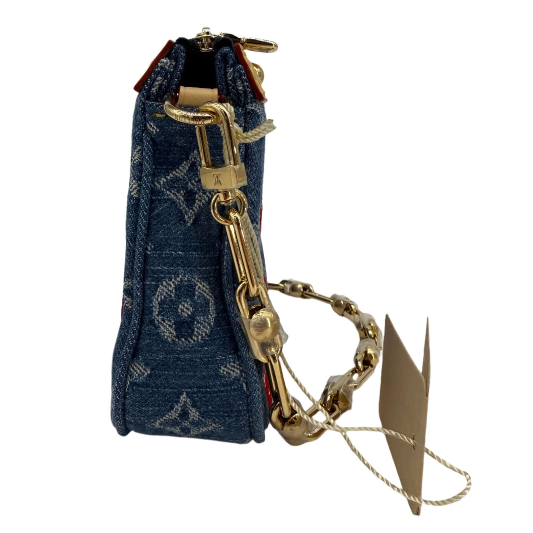 Side view of Authentic Louis Vuitton x Murakami Pochette Accessoires in Monogram Cherry Denim, showcasing craftsmanship and detail.