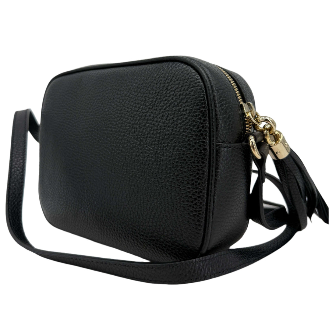 Gucci Small Soho Disco Bag in black pebbled calfskin leather with gold tassel detail and slim shoulder strap.