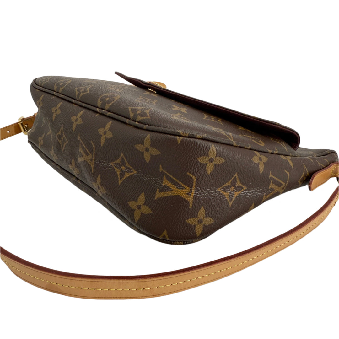 Side view of the Louis Vuitton Monogram Mabillon Shoulder Bag showcasing its iconic monogram canvas and structured design.