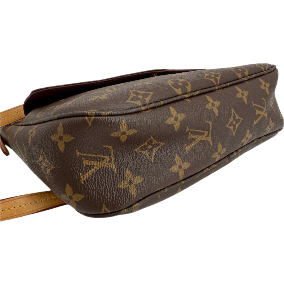 Side view of Louis Vuitton Monogram Mabillon Shoulder Bag showcasing iconic monogram canvas and structured design.