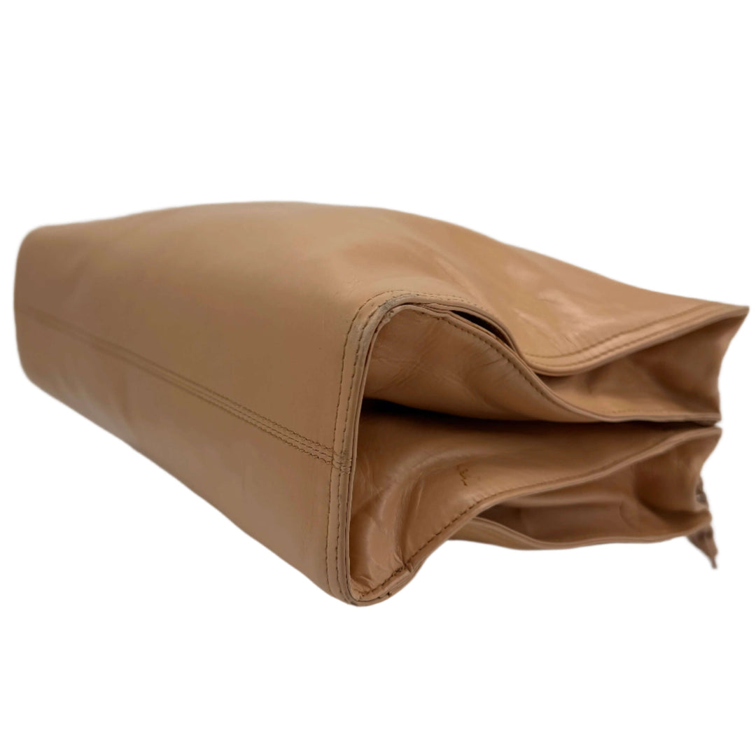 Bottega Veneta Intrecciato Leather Bag in beige showcasing its luxurious woven design.