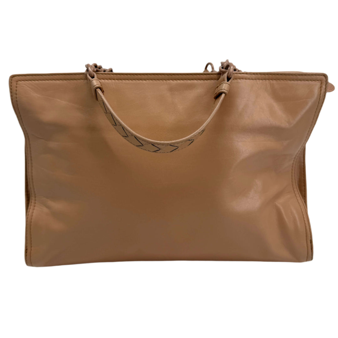 Bottega Veneta Intrecciato leather bag in beige, featuring signature woven design and soft rectangular silhouette.