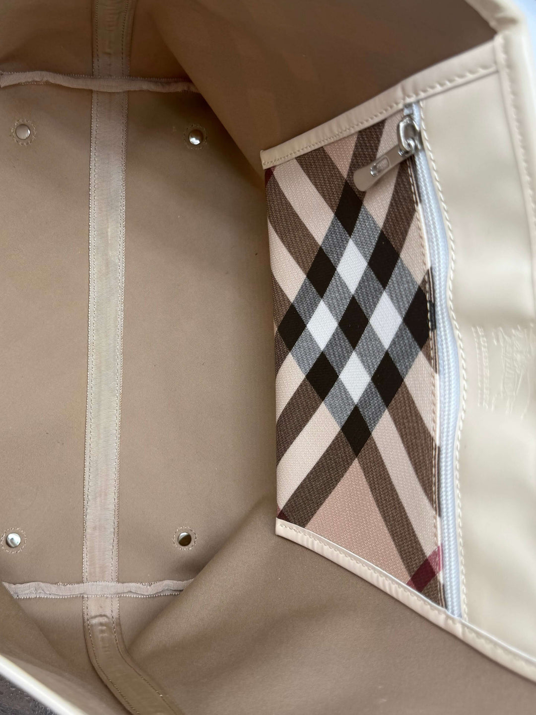 Interior view of Burberry Nova Check Large Nickie Tote featuring spacious design and signature check pattern pocket.