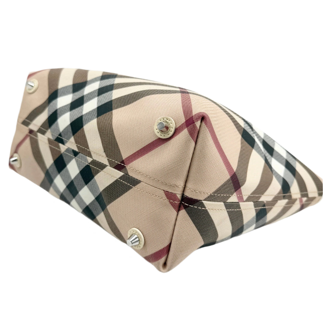 Burberry Nova Check Large Nickie Tote base with classic check pattern and metal feet, showcasing luxury and style.