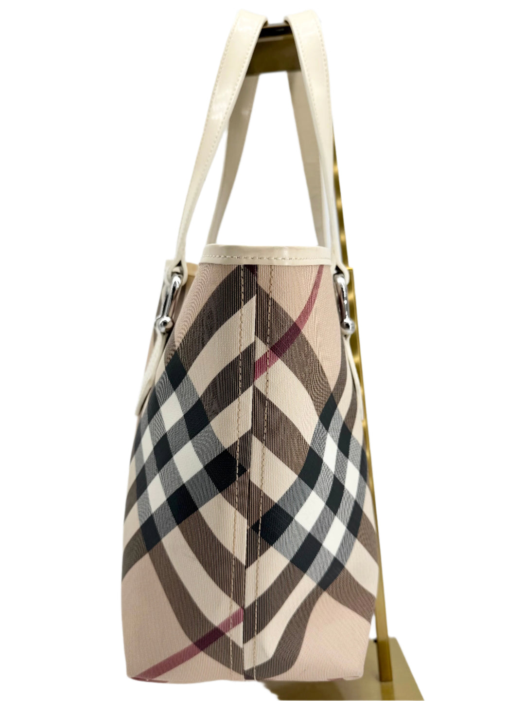 Side view of Burberry Nova Check Large Nickie Tote in white leather and classic check pattern.