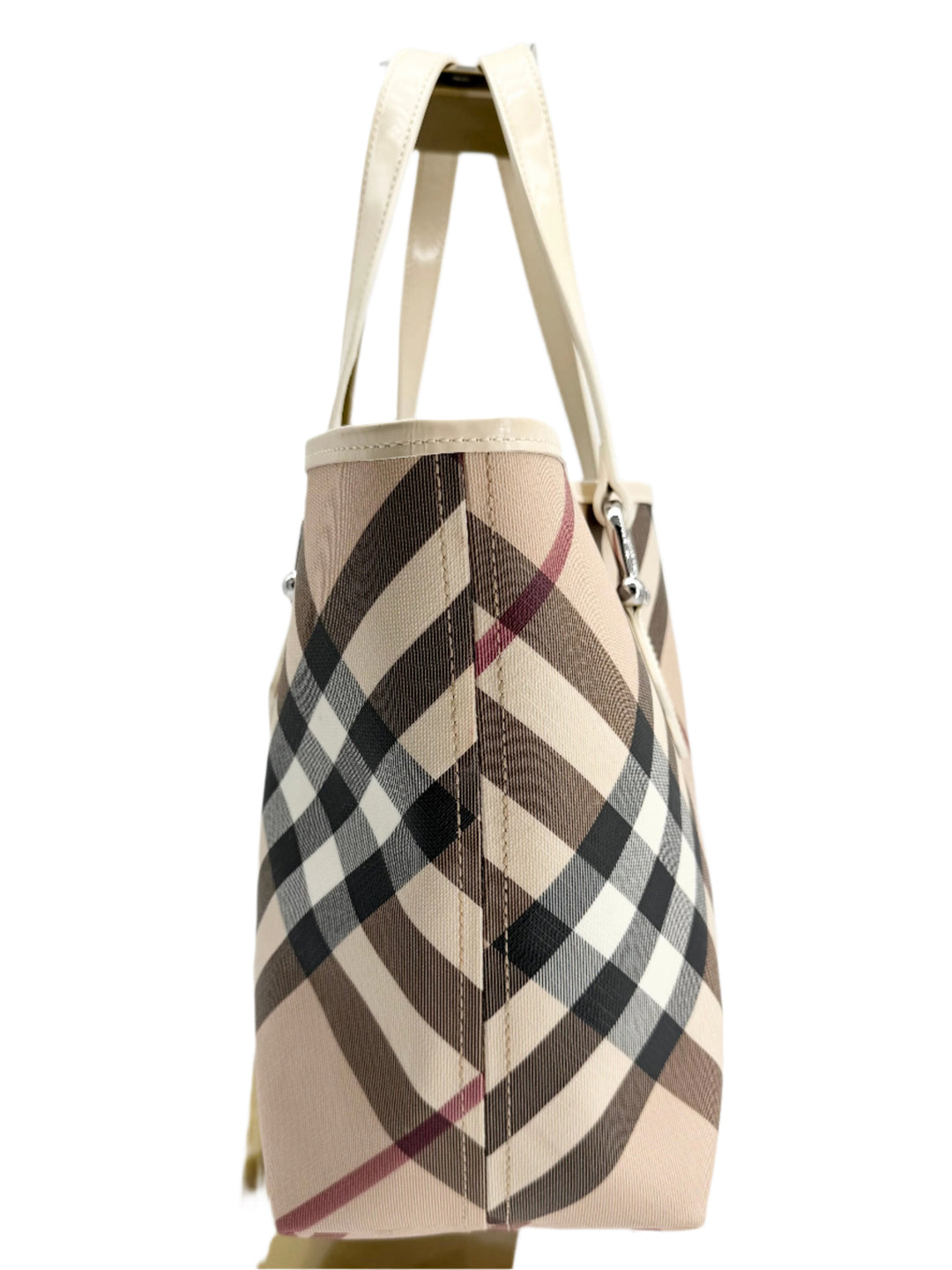 Side view of Burberry Nova Check Large Nickie Tote featuring classic check pattern and white leather handles.