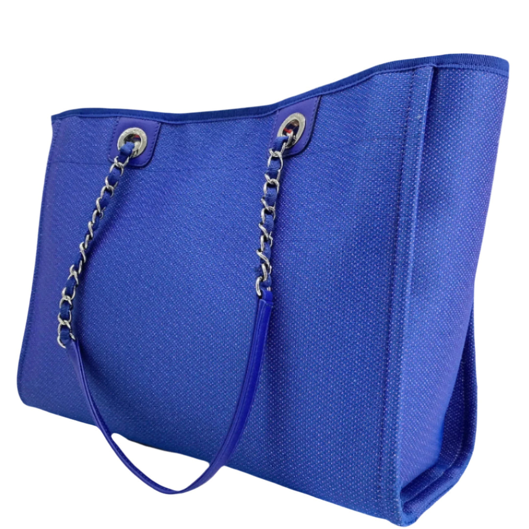 Chanel Small Deauville Tote in blue canvas with chain strap and elegant design.