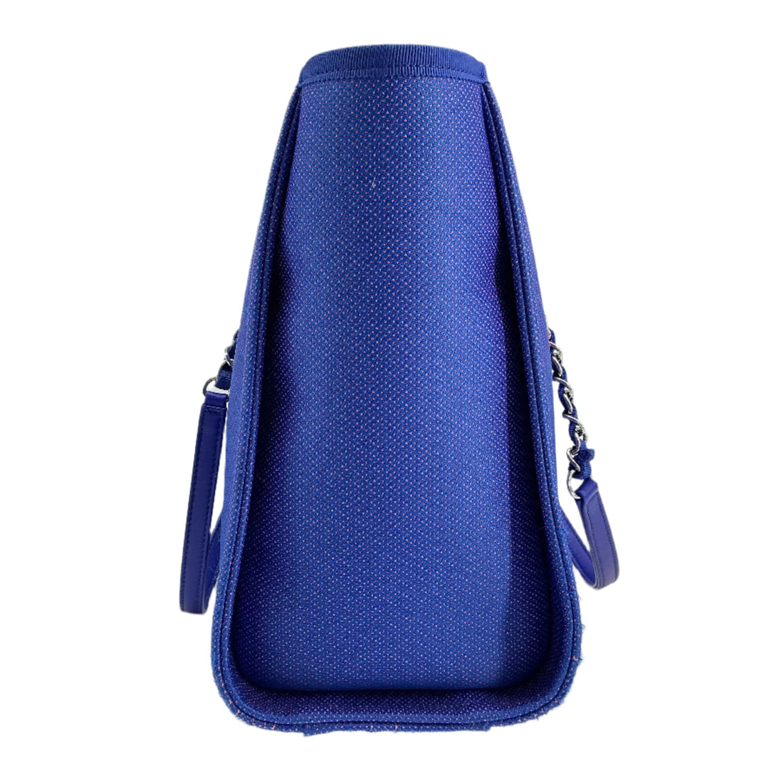 Chanel Mixed Fibers Small Deauville Tote in vibrant blue canvas with leather handles, showcasing its elegant design.