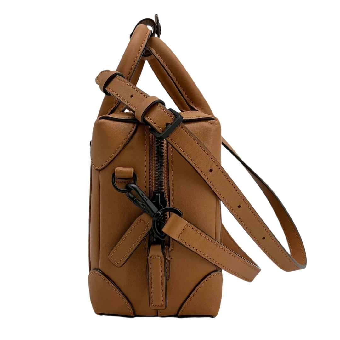 Side view of Fendi Zucca Mini Baguette bag in tobacco canvas with brown leather accents.