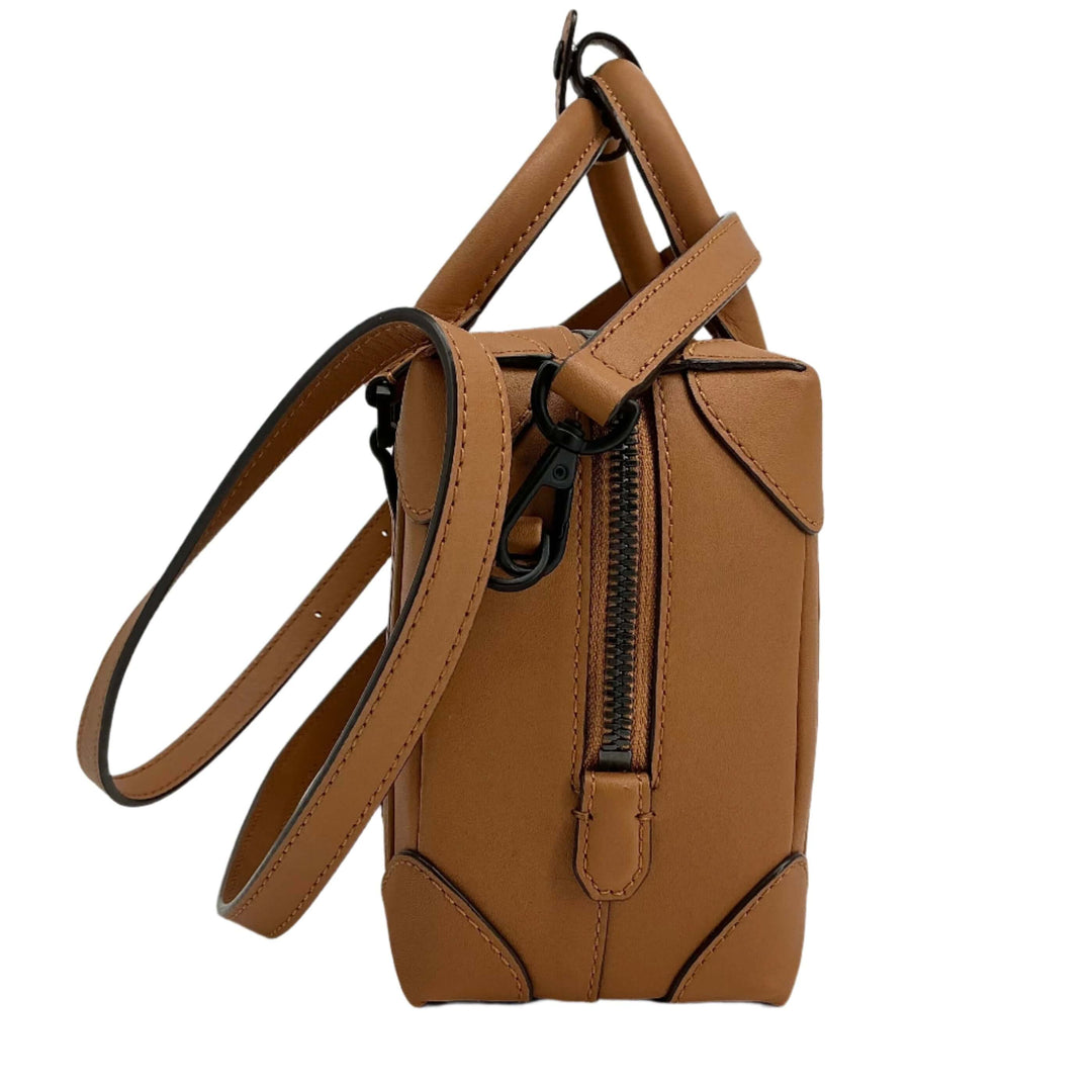 Fendi Zucca Mini Baguette in tobacco canvas and brown leather with silver-tone hardware, showcasing stylish design.