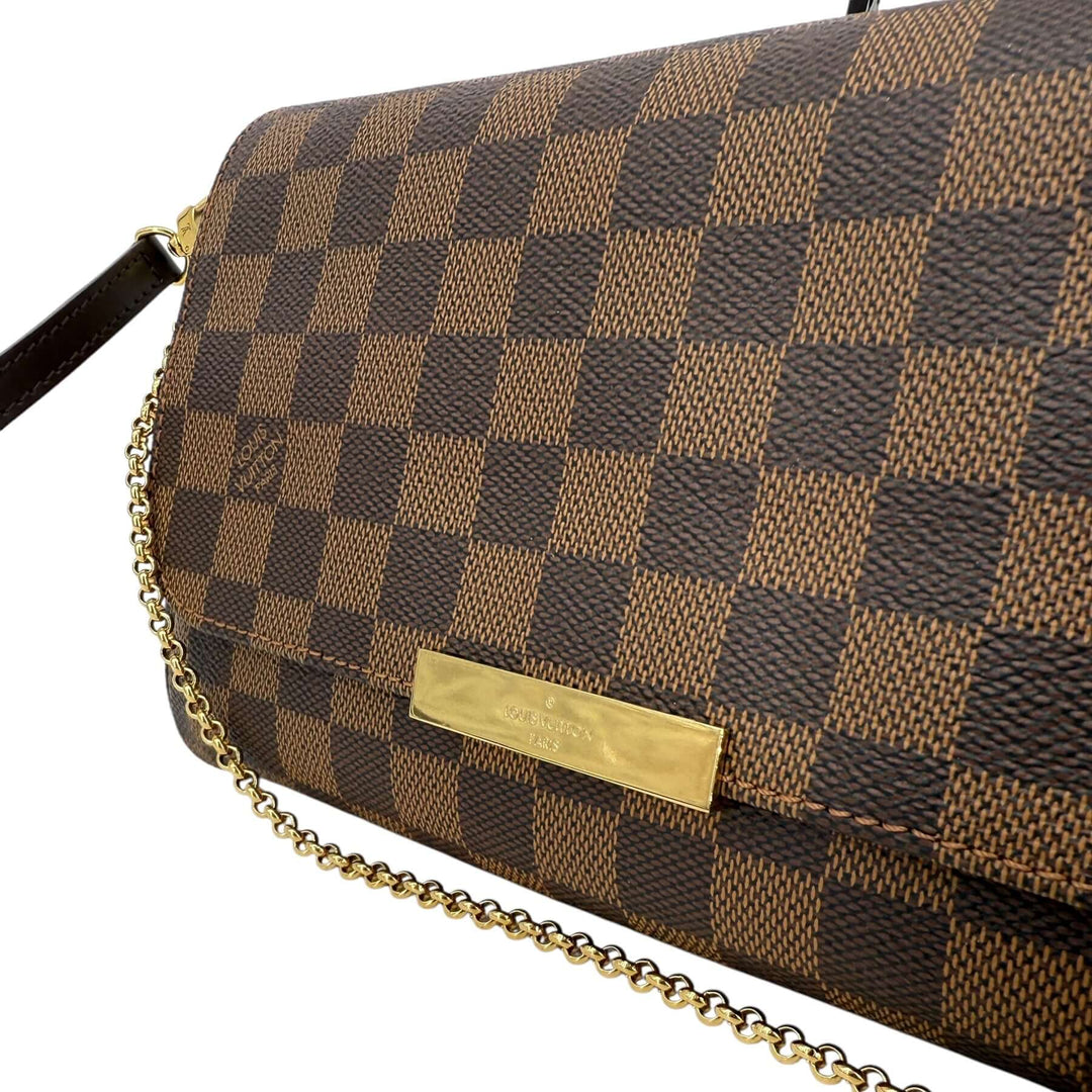 Louis Vuitton Damier Ebene Favorite MM Bag | LuxLoveLouis with gold-tone nameplate and chain strap.