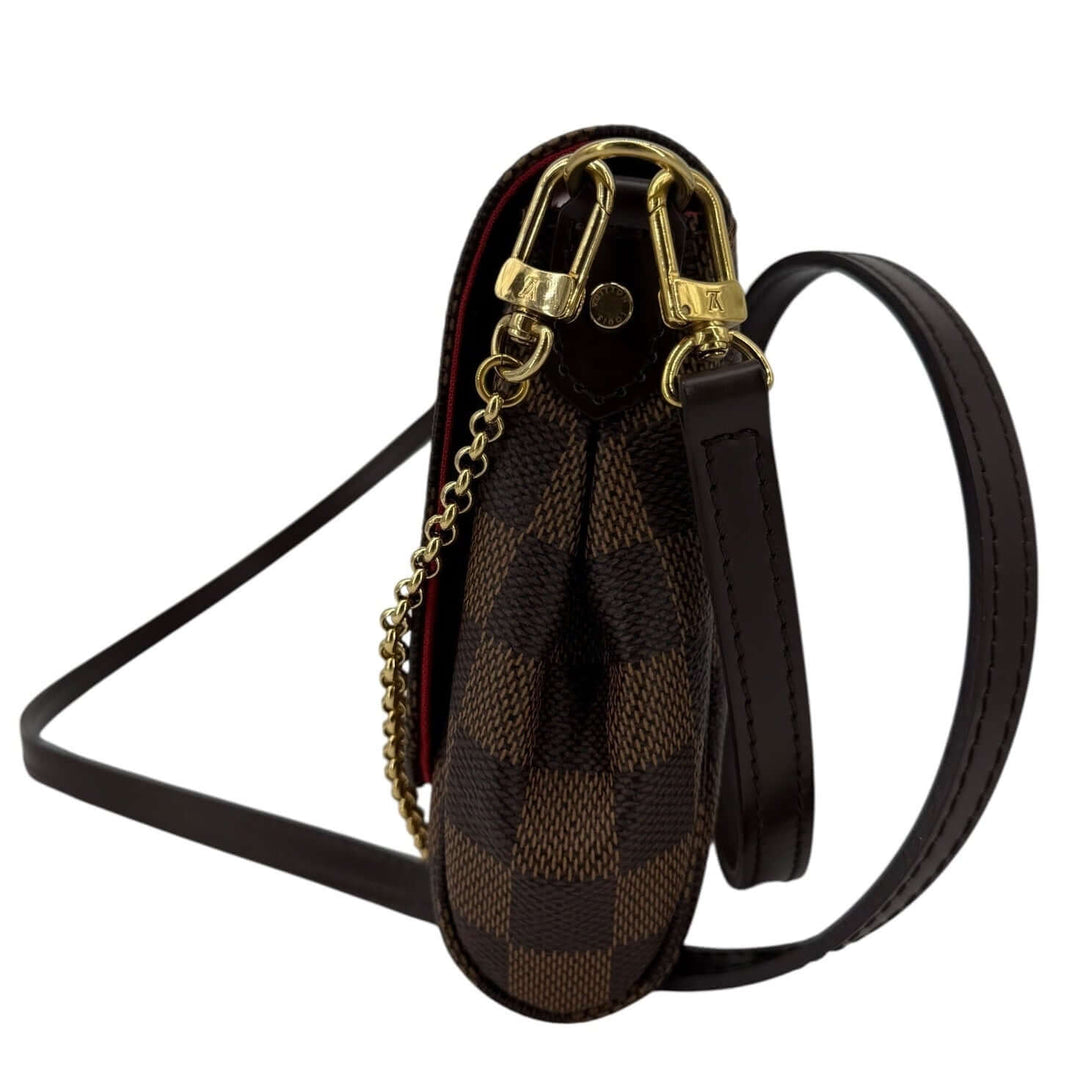 Louis Vuitton Damier Ebene Favorite MM Bag | LuxLoveLouis side view showcasing the stylish pouch design and gold-tone hardware.