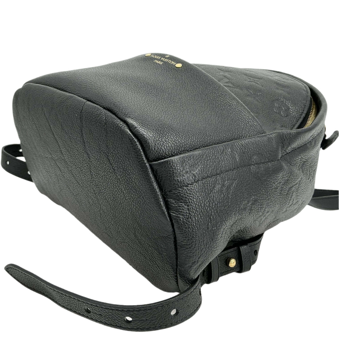 Close-up of Louis Vuitton Empreinte Sorbonne Backpack in Noir Black leather, showcasing its luxurious texture and sleek design.