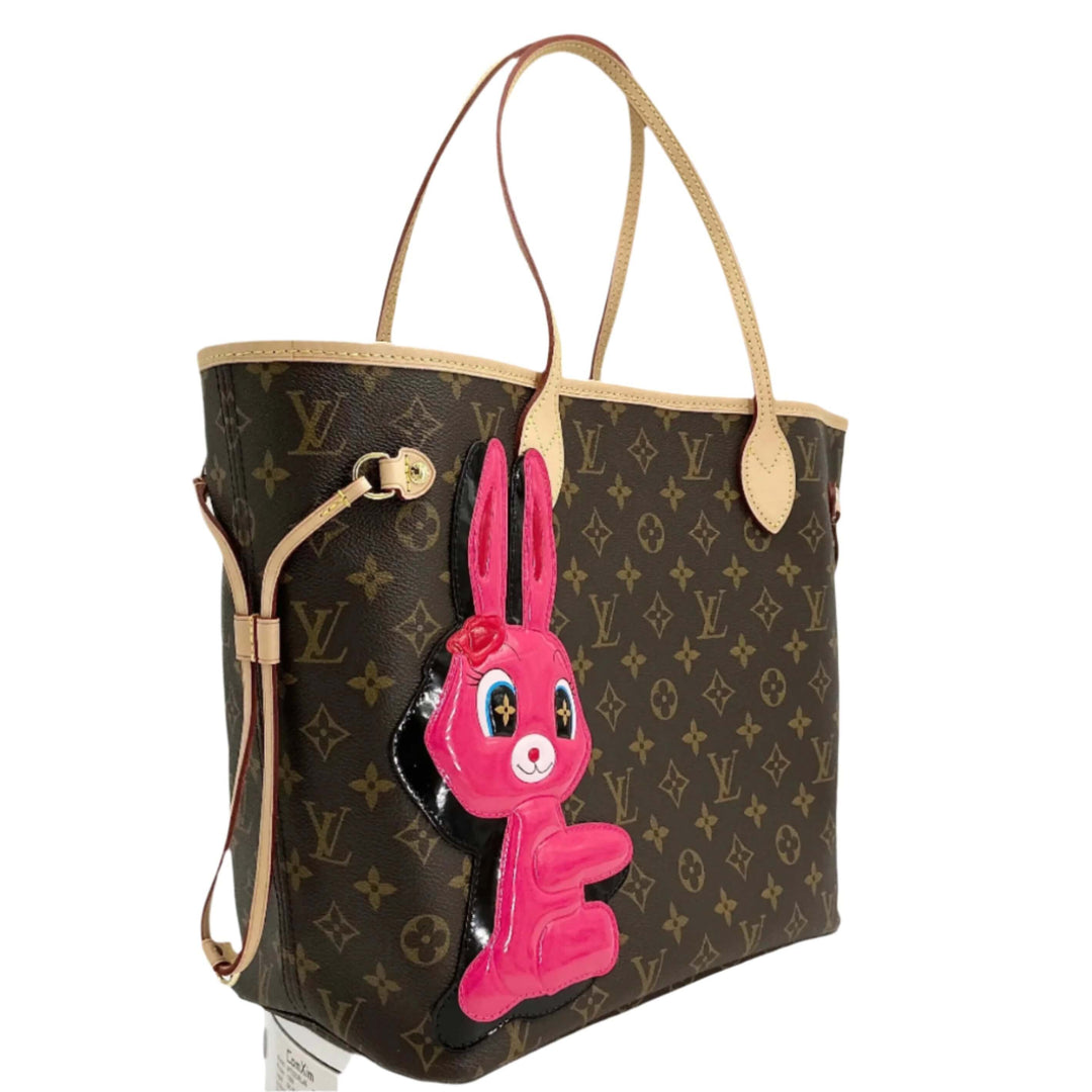 Louis Vuitton Neverfull MM bag featuring Monogram canvas and Sun Yitian's pink bunny patch accent.
