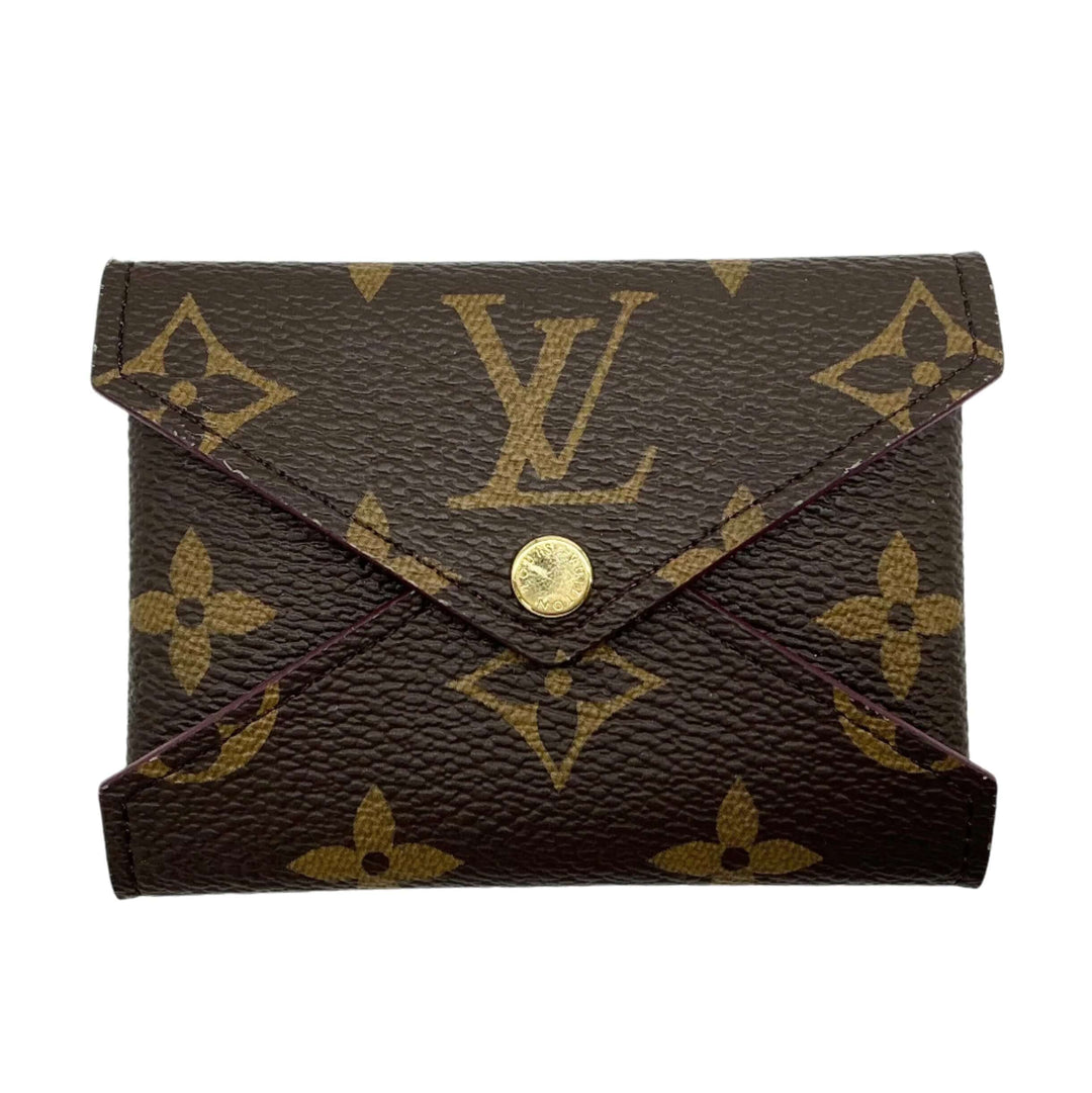 Louis Vuitton Small Kirigami Pochette Insert in monogram canvas with gold-tone snap closure, vibrant accessory with fuchsia leather interior.