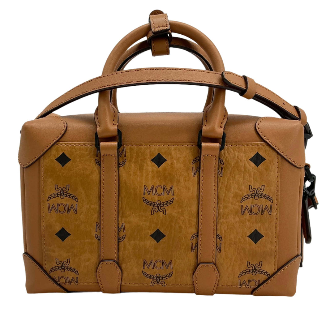 MCM bag in tan leather featuring iconic MCM logo and diamond pattern, showcasing stylish design and practicality.