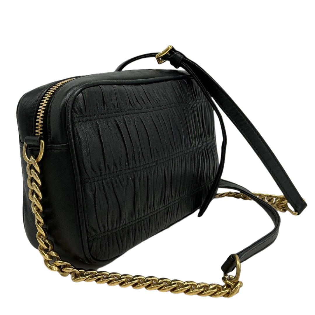 Prada Nappa Gaufre Camera Bag in black pleated lambskin leather with gold-tone chain strap.
