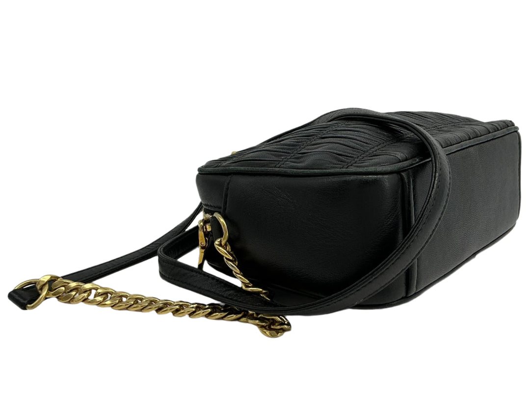 Prada Nappa Gaufre Camera Bag in black pleated lambskin leather with gold-tone chain strap.