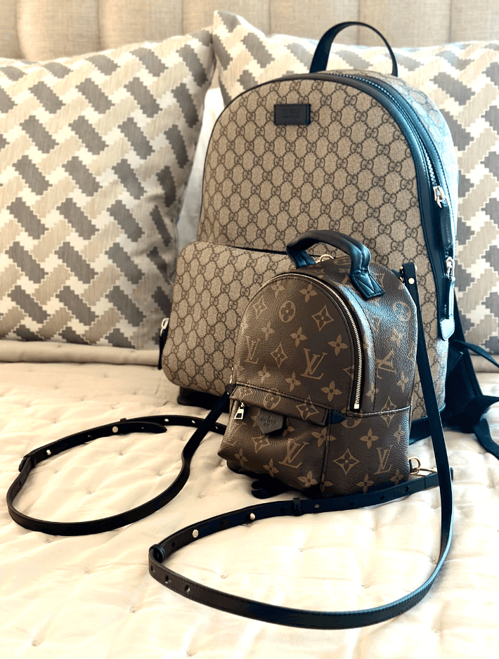 Chanel Handbags: Are They Worth the Investment? Luxury bags displayed on a stylish bed for fashion enthusiasts.