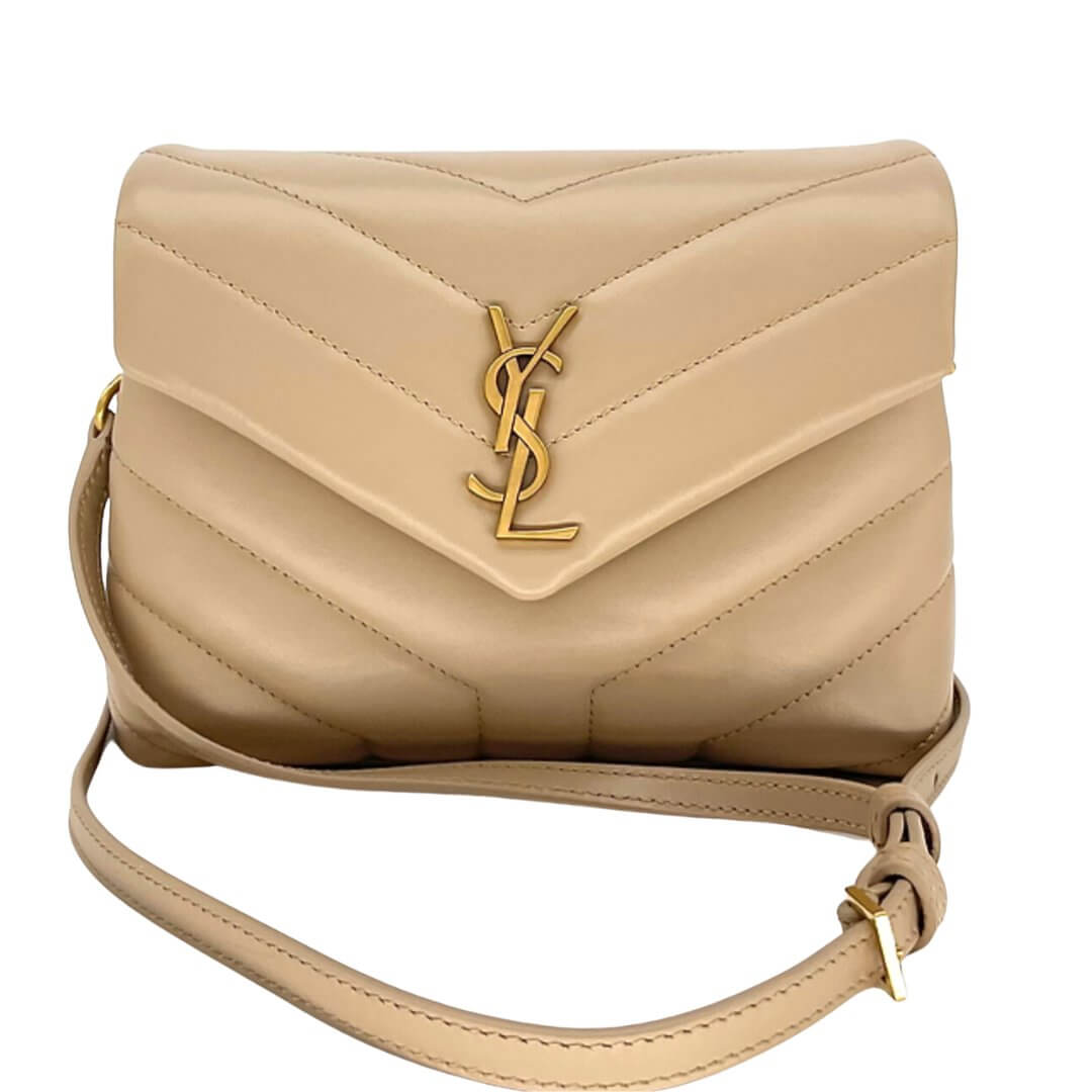 Authentic Saint Laurent beige quilted handbag with gold YSL logo, front view