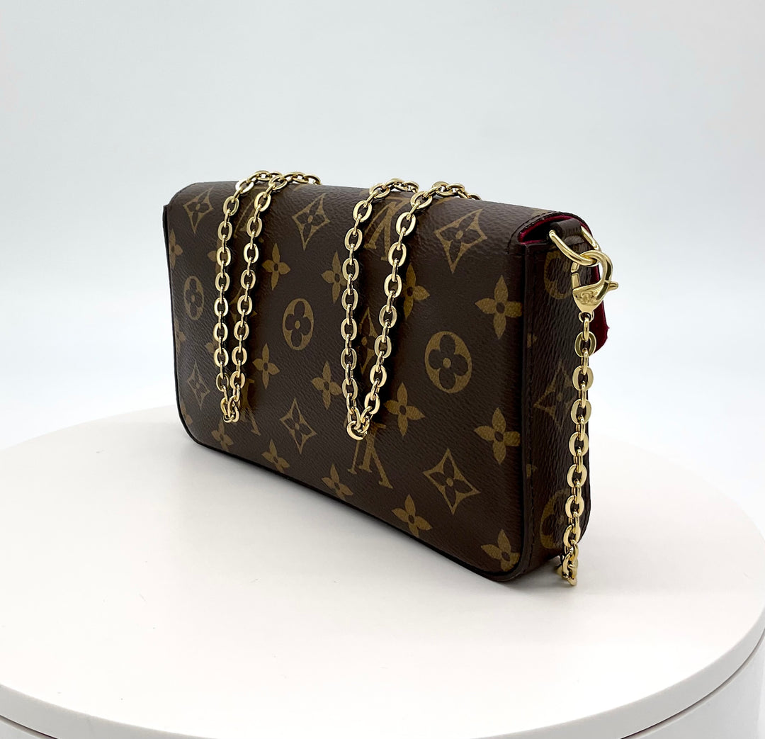 LOUIS VUITTON Monogram Felicie Pochette with chain strap, brown monogram canvas, elegant and stylish design.
