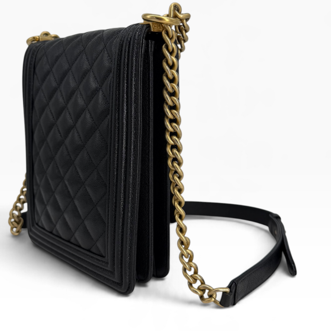 Chanel North South Boy Bag opposite rear angle showing diamond quilting, side gussets and gold-tone chain