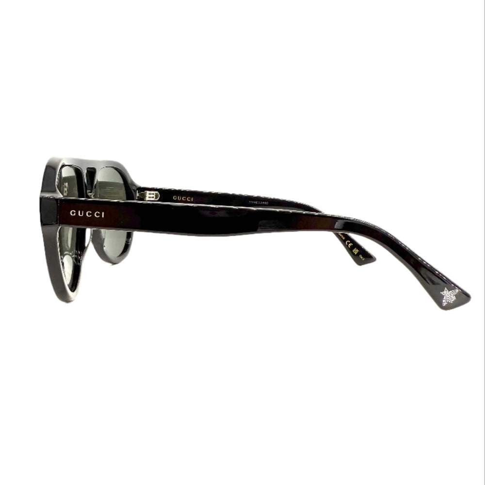 Authentic Gucci GG0159SN sunglasses side view showcasing sleek black frames and logo detail.