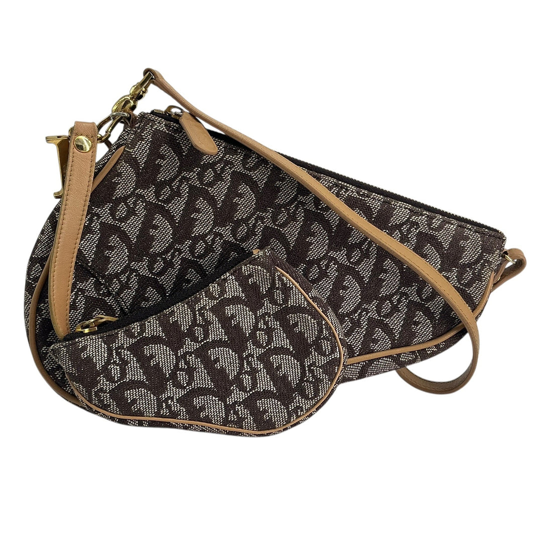 A Dior monogram shoulder bag in brown and beige canvas with tan leather trim and gold-tone hardware, shown on a plain white background.