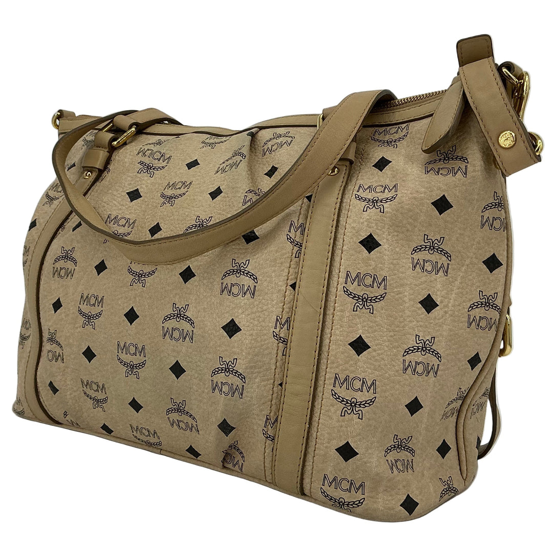 MCM Visetos Medium Essentials Shopper Tote in beige with black monogram print, luxurious everyday carryall.