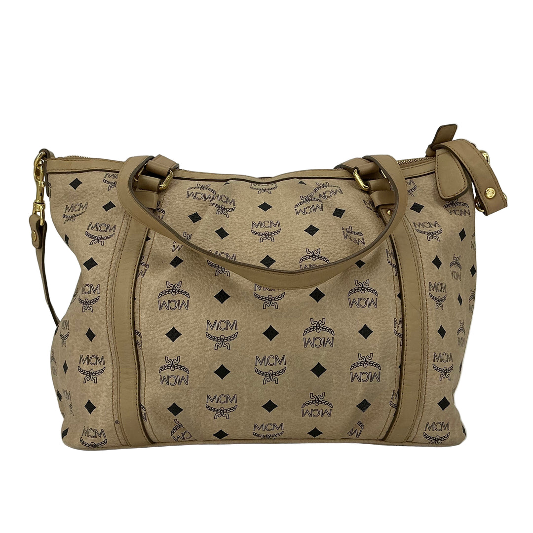 MCM Visetos Medium Essentials Shopper Tote in beige with black monogram, featuring leather trim and gold hardware.