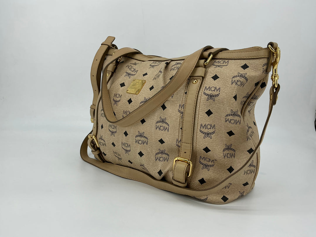 MCM Visetos Medium Essentials Shopper Tote in beige with black monogram print and leather trim, stylish and versatile carryall.