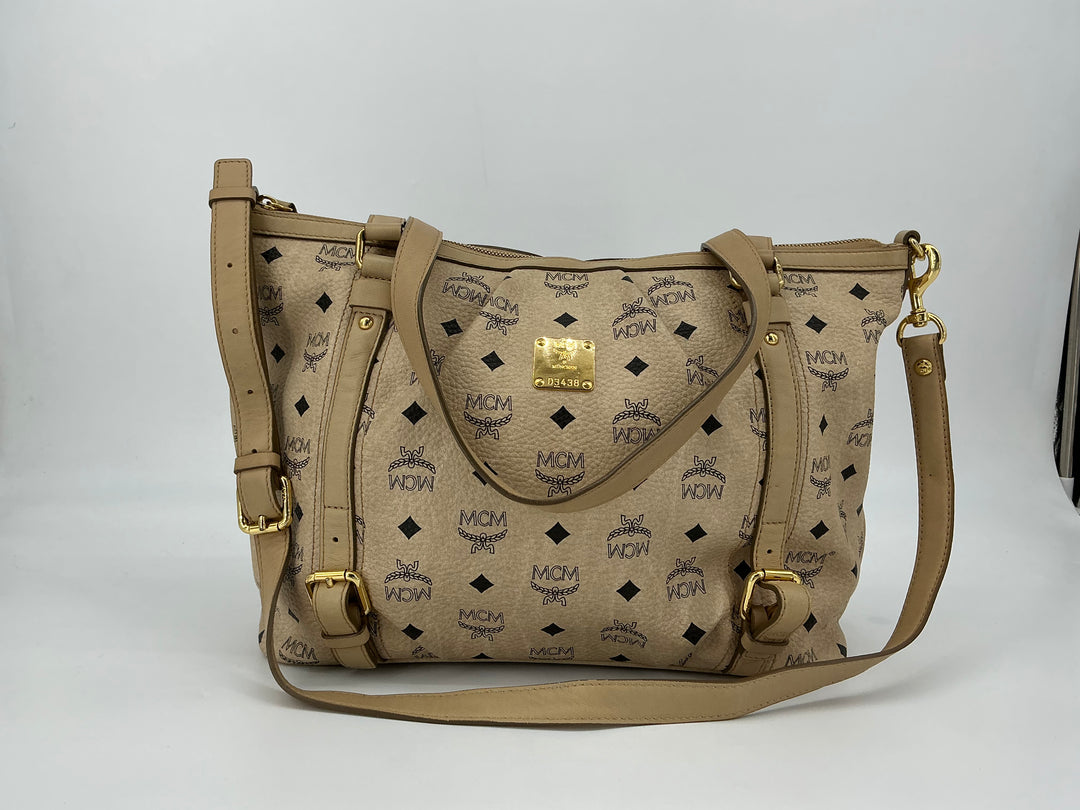 MCM Visetos Medium Essentials Shopper Tote in beige with black monogram print and leather trim, perfect for everyday use.