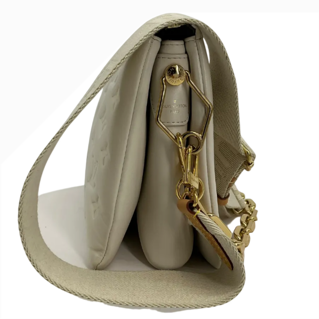 Louis Vuitton Coussin PM cream lambskin three quarter side condition