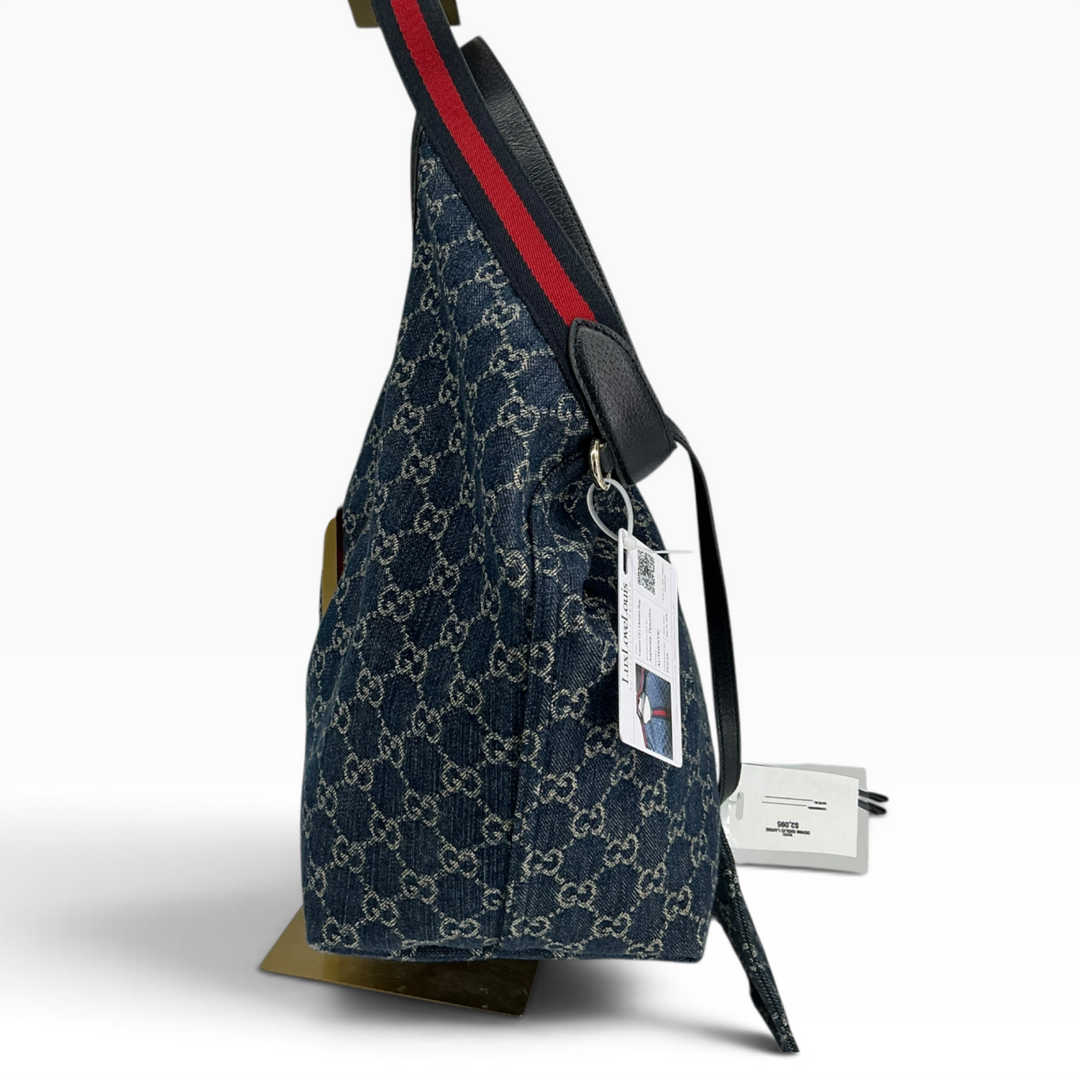 Gucci Giglio Large Tote blue GG denim side profile with pouch