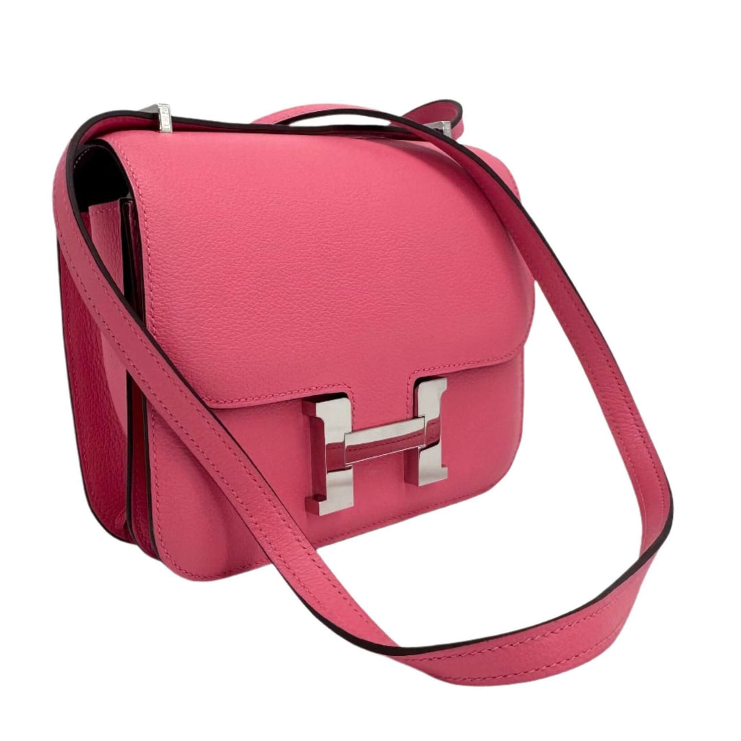 HERMES Epsom Constance 24 Shoulder Bag in pink leather with silver hardware and adjustable strap.