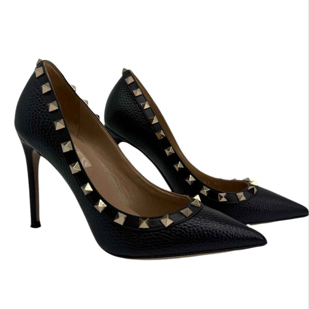 Valentino Garavani black pebbled calfskin Rockstud pumps with gold-tone studs, elegant high heels.