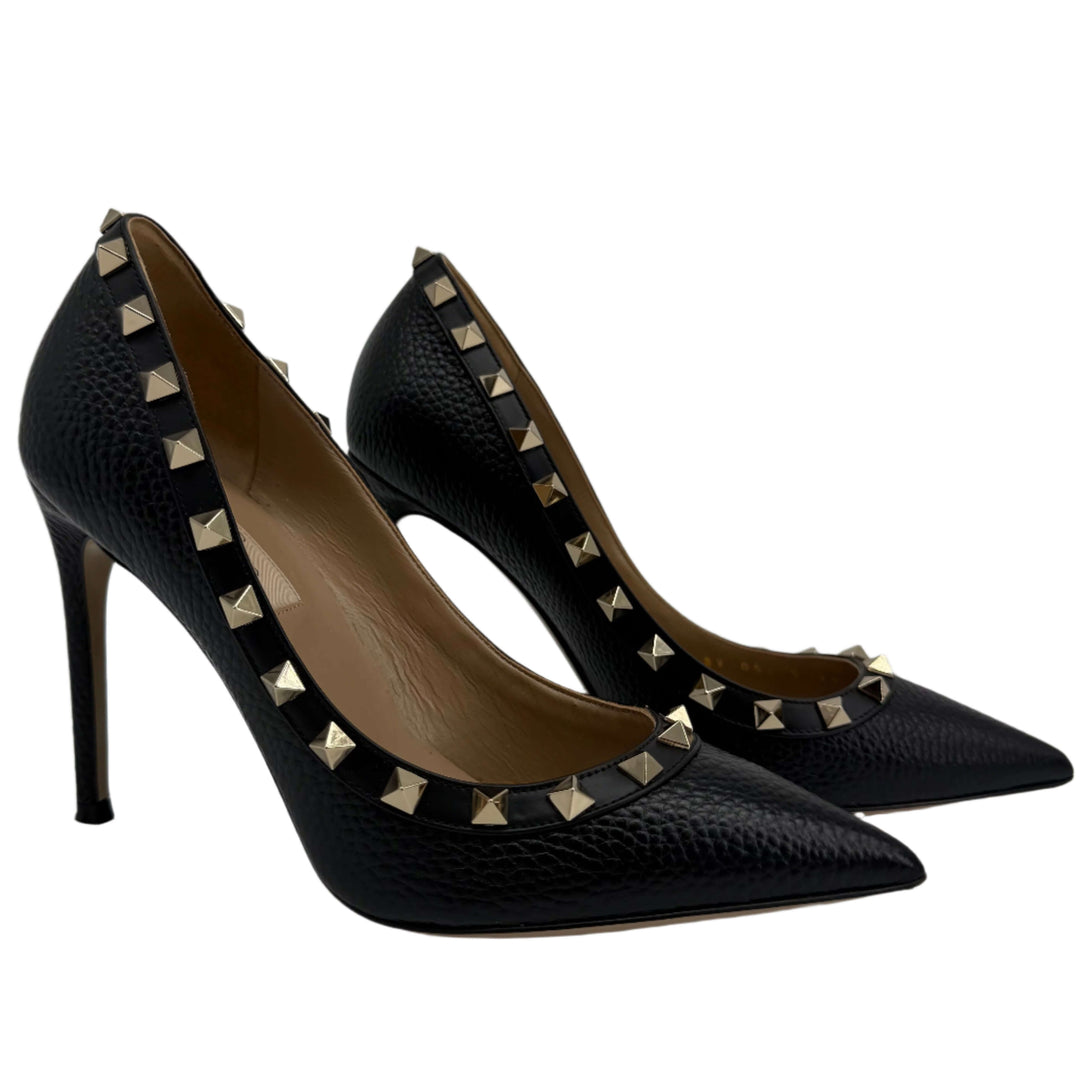 Valentino Garavani Rockstud 85mm Pumps in black pebbled leather with gold-tone studs, showcasing refined elegance.
