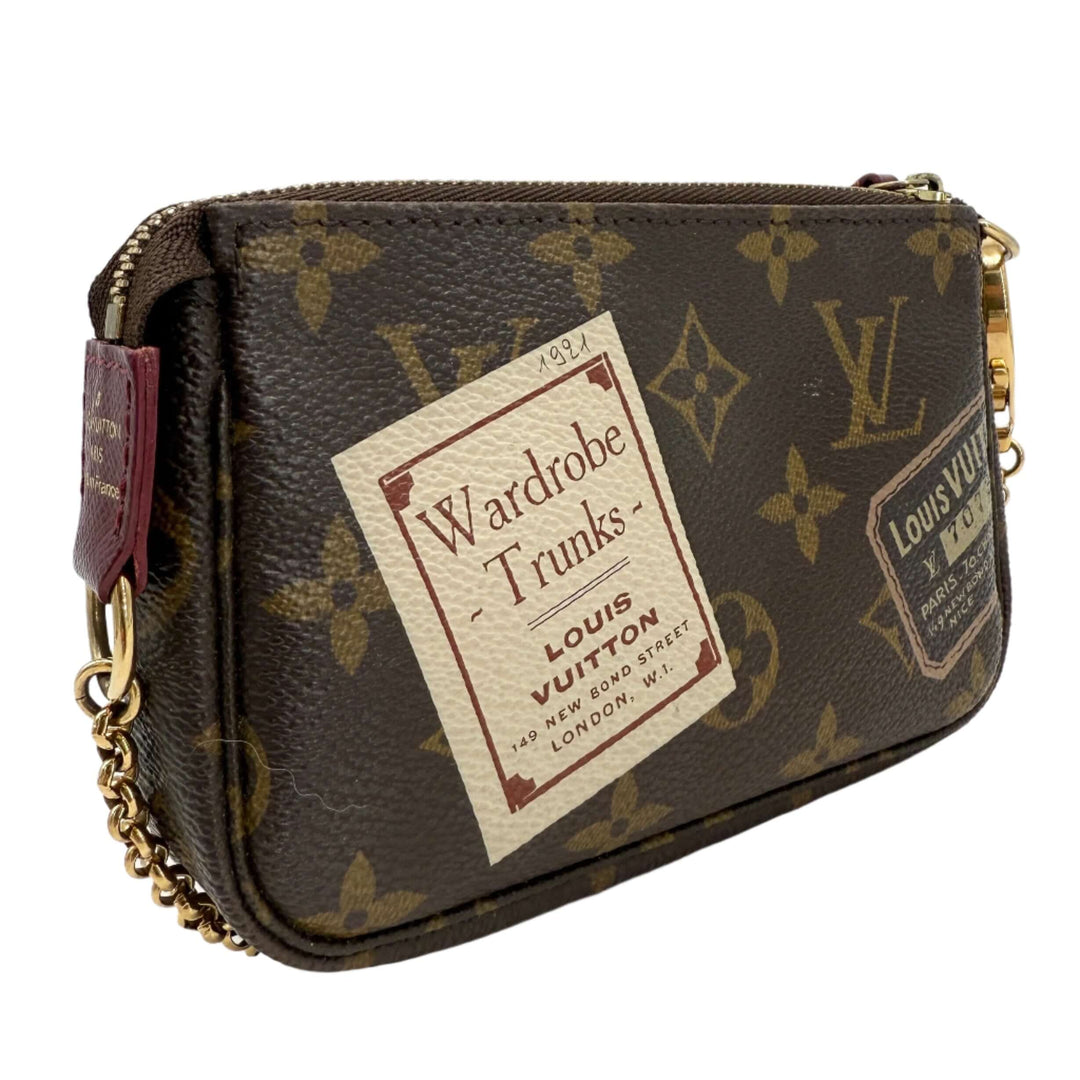 Louis Vuitton Monogram Stamp Mini Pochette with vintage-inspired illustrations and gold chain, showcasing timeless elegance.