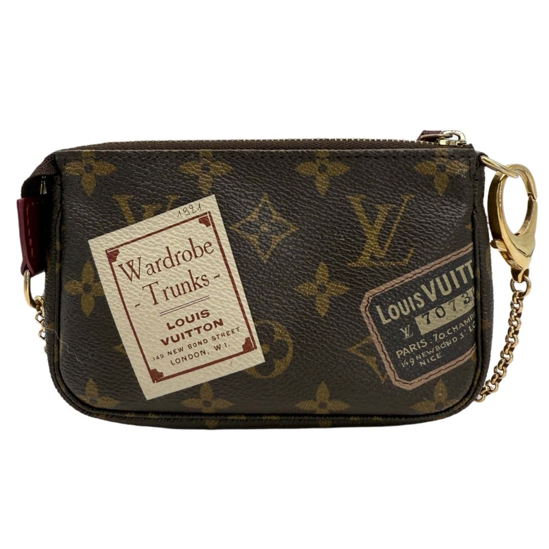 Louis Vuitton Monogram Stamp Mini Pochette Accessories with vintage stamps and iconic design in coated canvas.