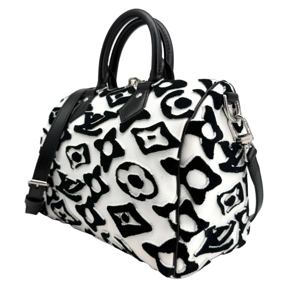 Louis Vuitton x Urs Fischer Speedy Bandoulière 25 bag in tufted white and black monogram, showcasing luxury and contemporary art.